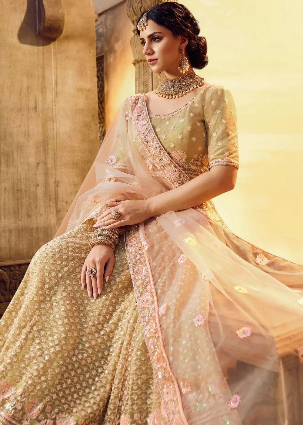 Golden Silk and Soft Net Bridal Lehenga Choli with Resham Embroidery and Aari work