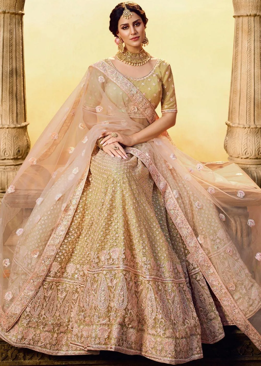 Golden Silk and Soft Net Bridal Lehenga Choli with Resham Embroidery and Aari work